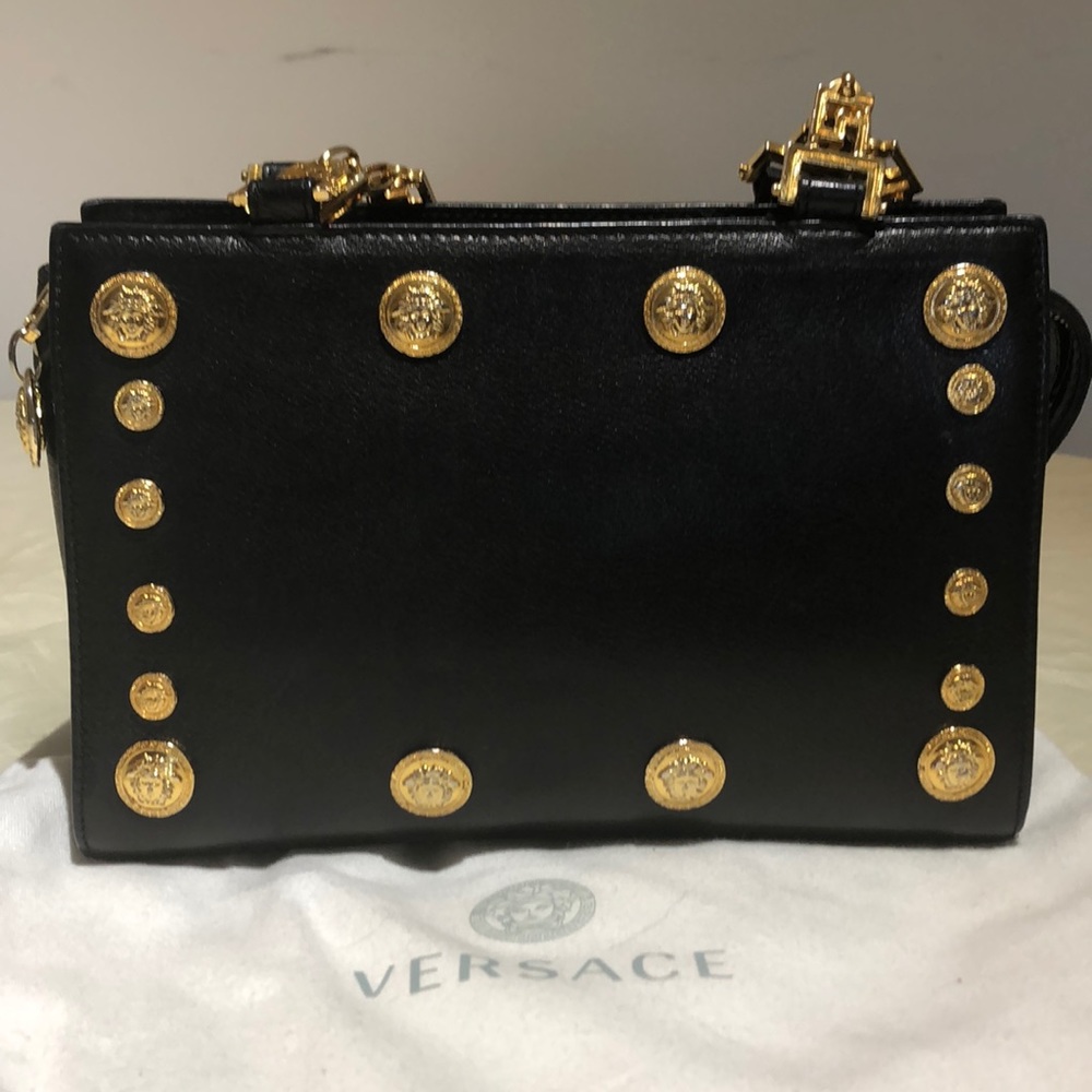 Women clutch gold shoulder strap  Versace bag $600
